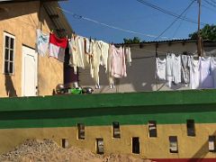03A A house on 1st Street has clothes drying on the line Trench Town Kingston Jamaica
